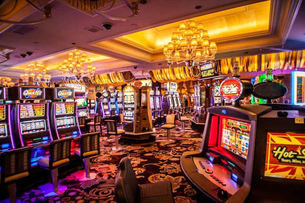 Interior of a vibrant casino showcasing various slot machines